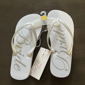 Size 5/6 “Bride” sandals. Never been worn. White:silver. Straps are sparkly.
